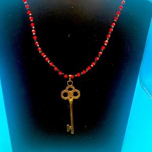 Red and black tiny crystal beads with gunmetal black key